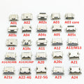 A collection of various micro USB charging port dock connector replacements for mobile phones, labeled with model names.