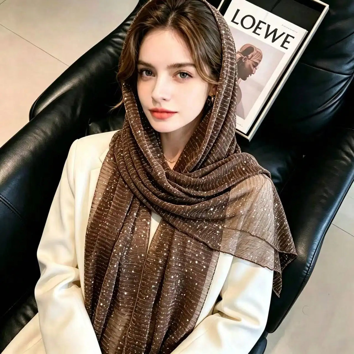 Woman wearing a brown sequin lightweight scarf as a headscarf