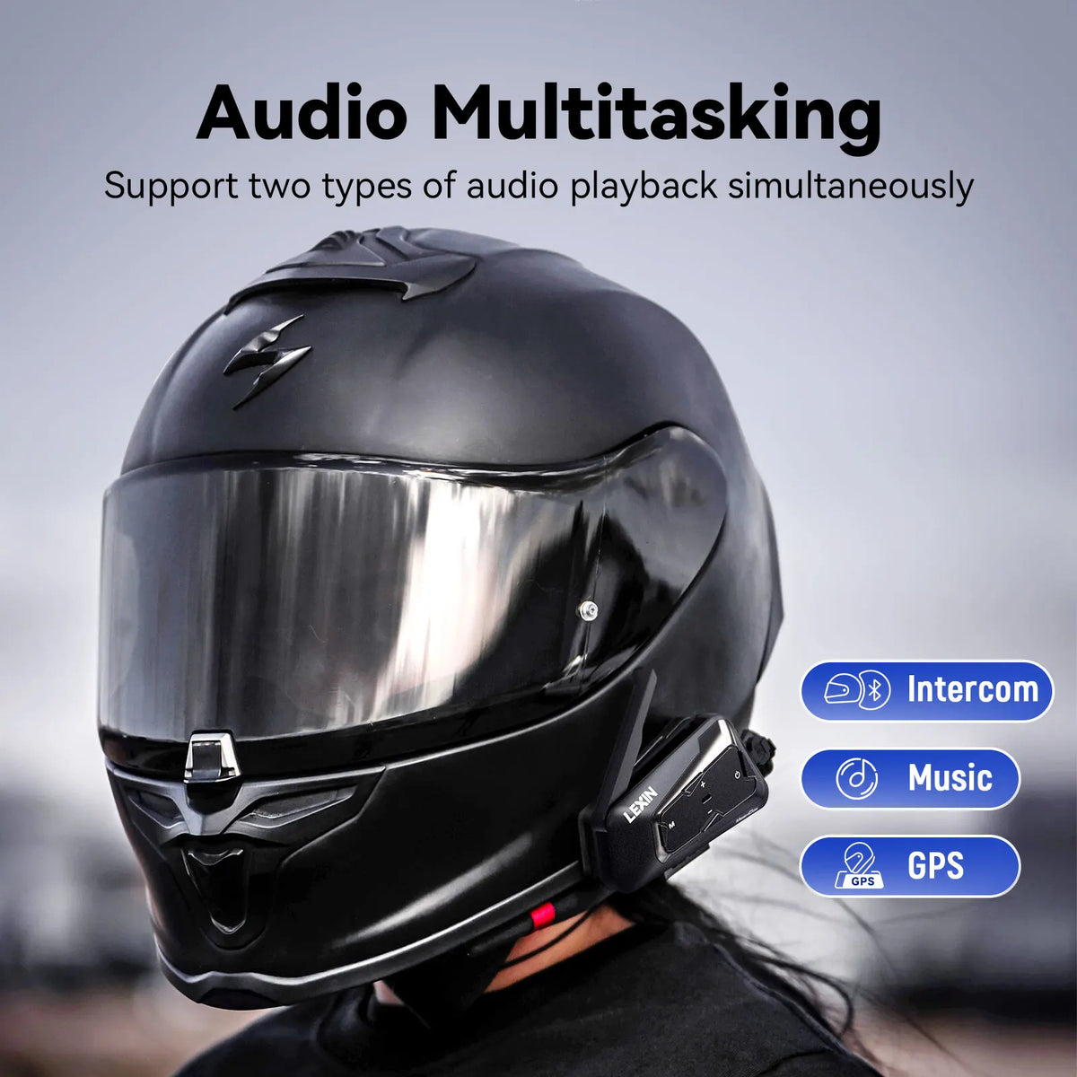 Black motorcycle helmet with an intercom unit attached showing audio multitasking features