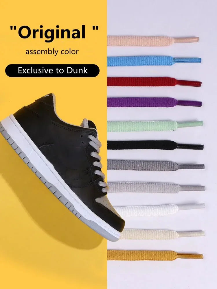 A single grey sneaker displayed with a vertical selection of various colored shoelaces.