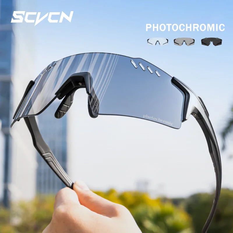 Photochromic cycling sunglasses with black frame and reflective lenses held in hand