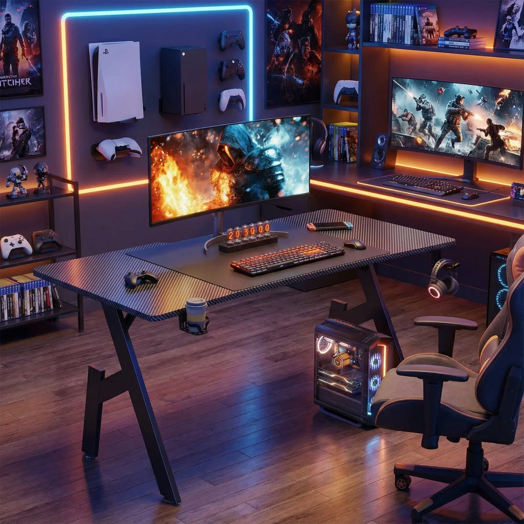 Black carbon fiber gaming desk in a fully equipped gaming room