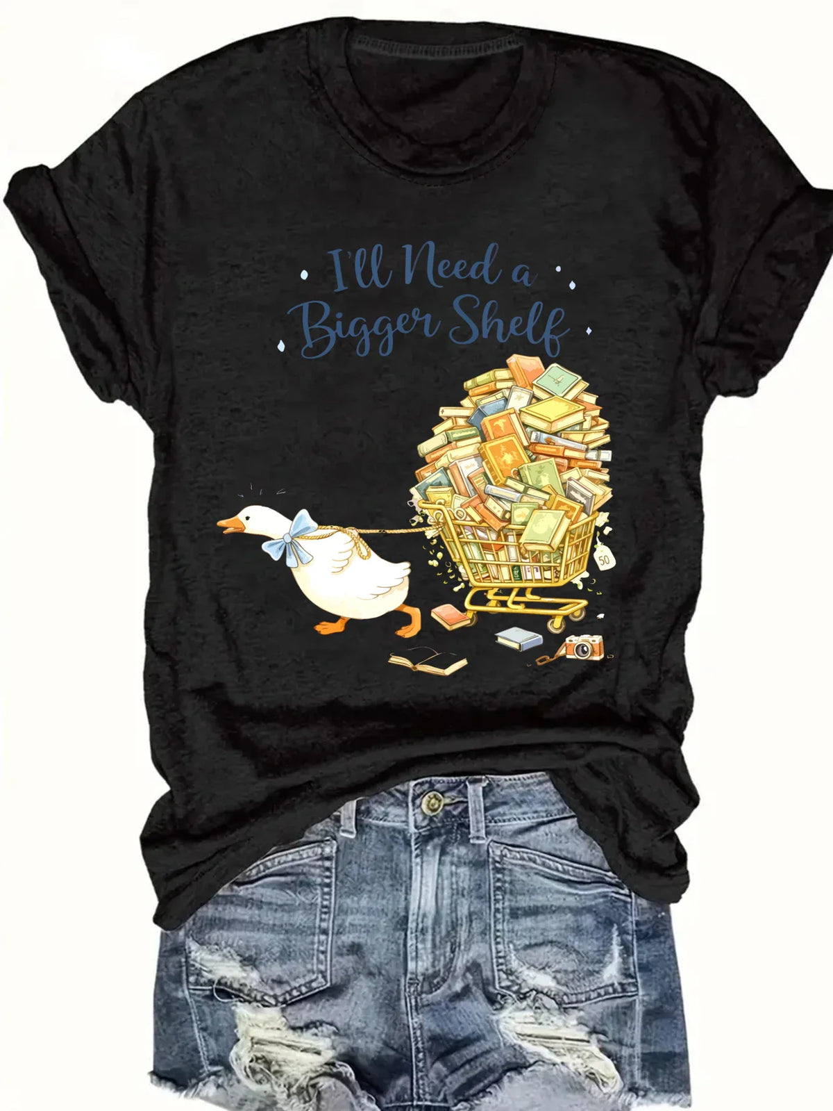 Black short-sleeved t-shirt with a duck pulling a book cart graphic print, styled with denim shorts
