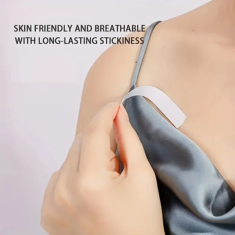 Application of invisible fashion tape to secure a thin dress strap to skin