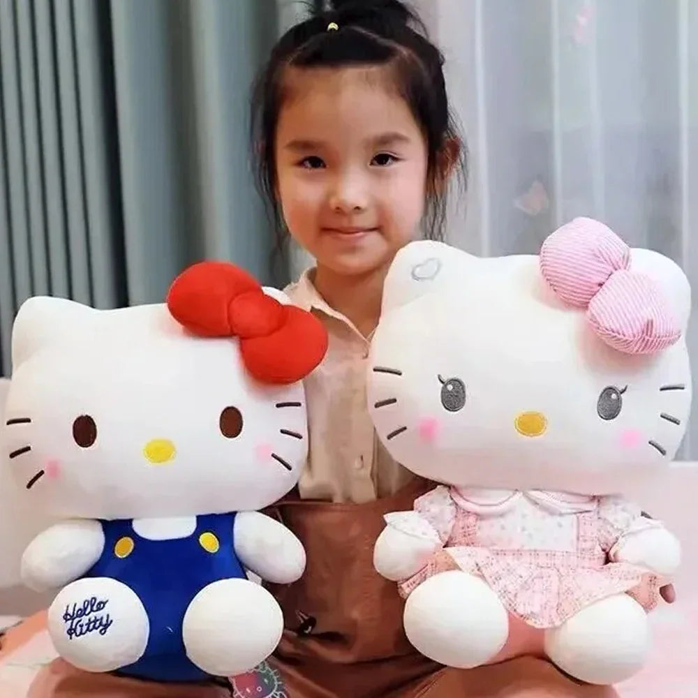 A child holding two white cat-themed plush toys with colorful bows and outfits.
