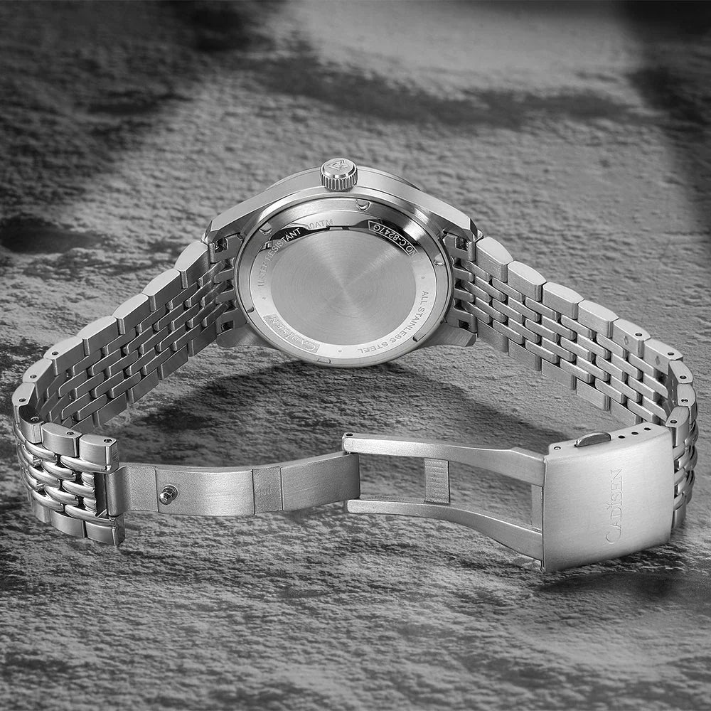 Back view of a silver automatic men's wristwatch showing the metal casing and deployment clasp.