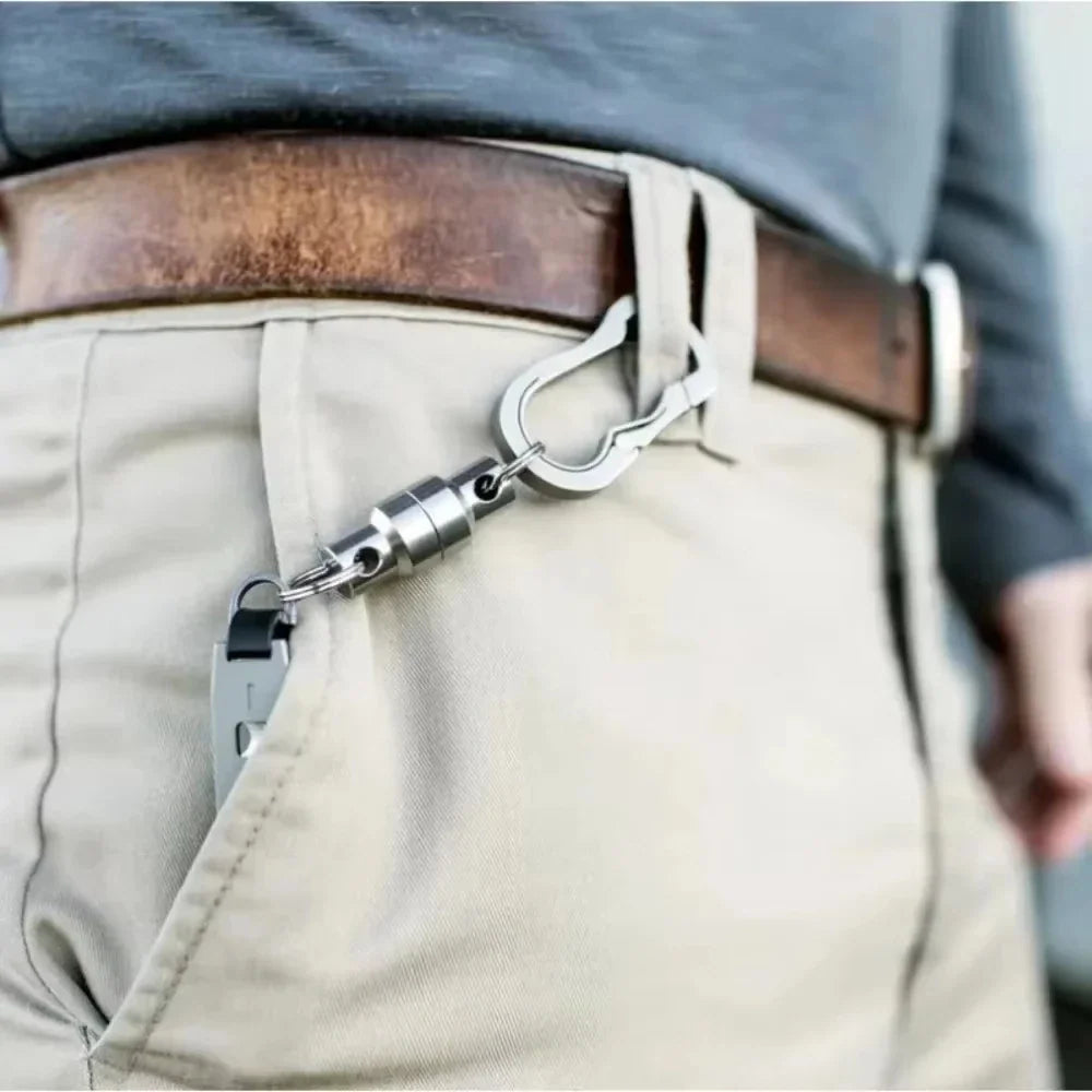 A magnetic keychain attached to a belt loop and a key.