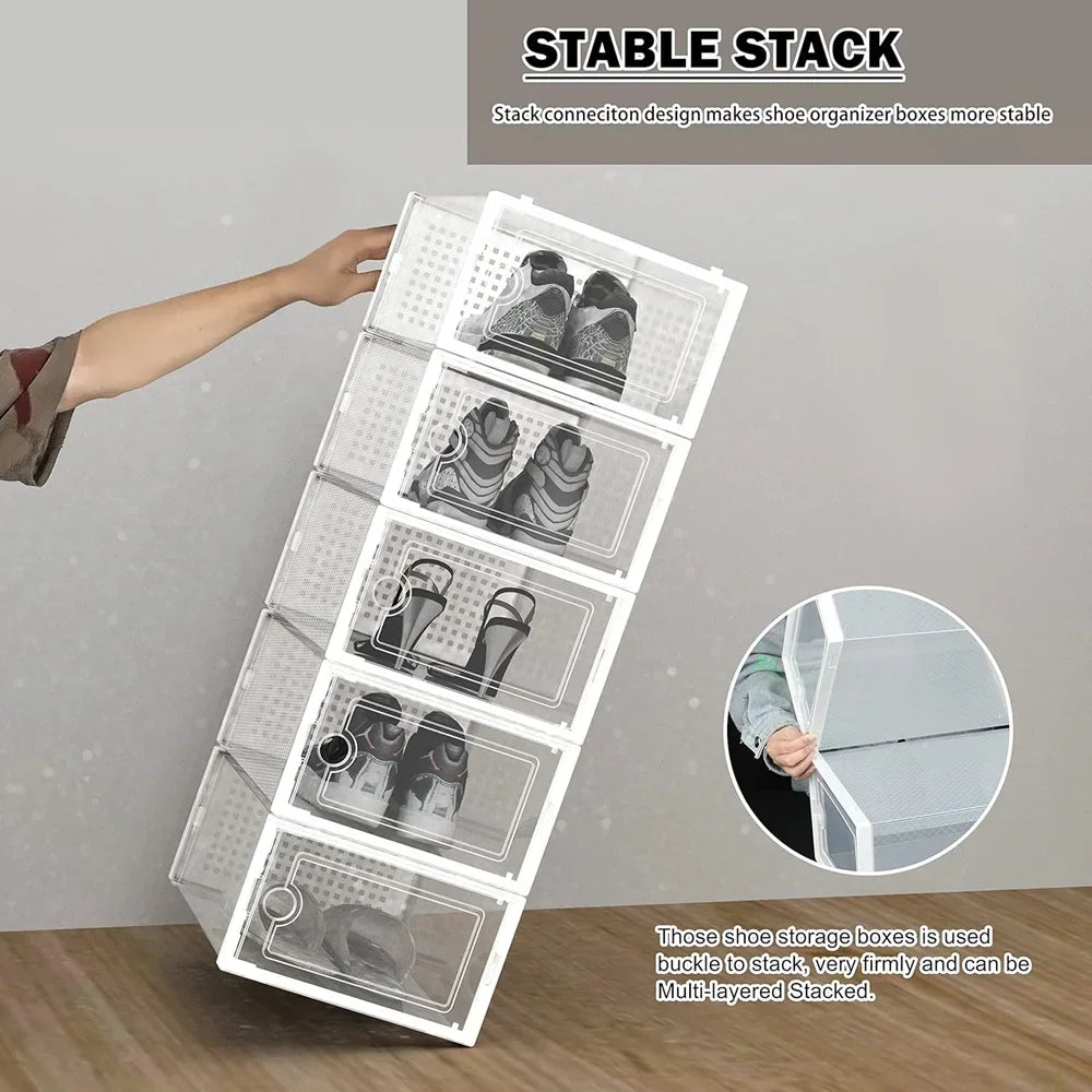 Hand stacking multiple transparent plastic shoe storage boxes to demonstrate stability and interlocking design