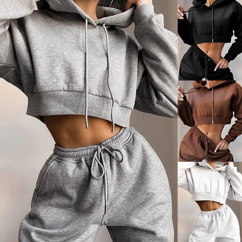 Women's casual long-sleeve crop hoodie and sweatpants tracksuit set available in grey, black, brown, and white