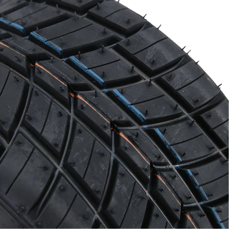 Close up of the tread pattern on a black rubber go kart tire