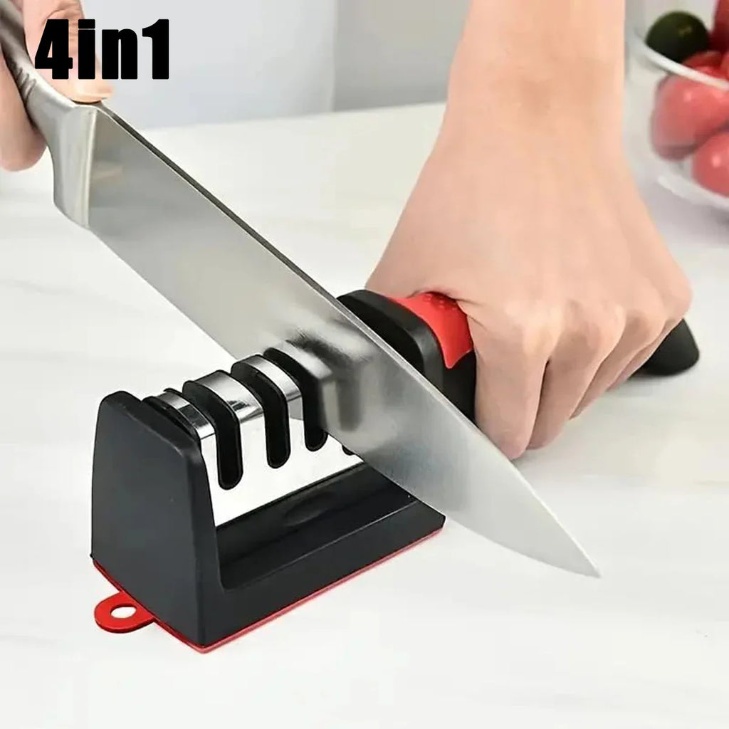 A hand using a 4-in-1 black and red manual knife sharpener on a kitchen counter.
