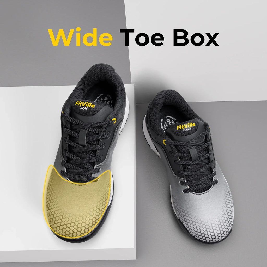 A pair of grey golf shoes displaying the wide toe box area with a yellow outline.
