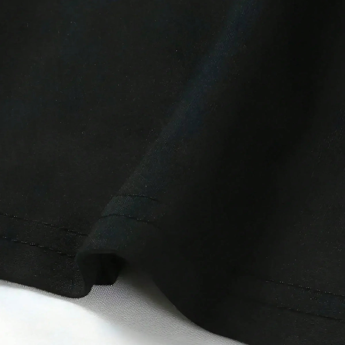 Close up of smooth black fabric of a t-shirt