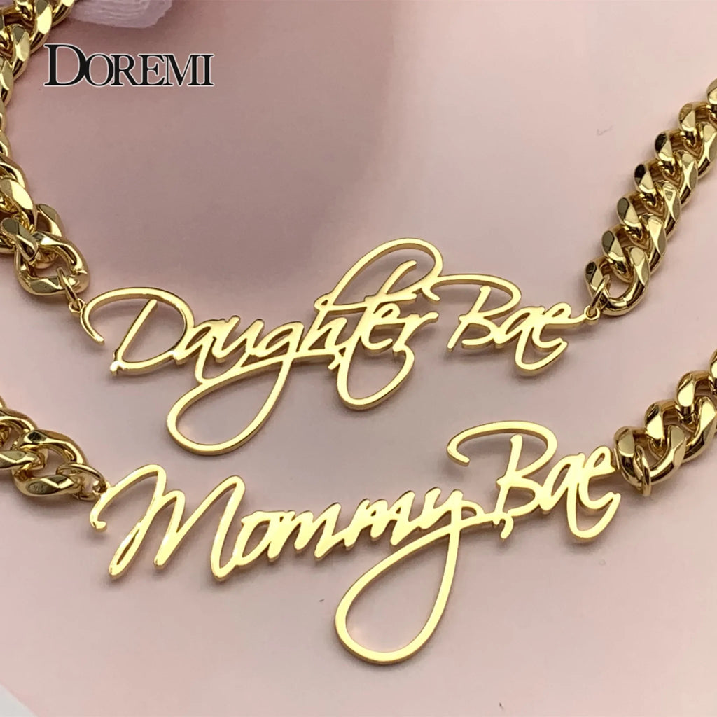Gold custom nameplate necklaces with thick cuban chains