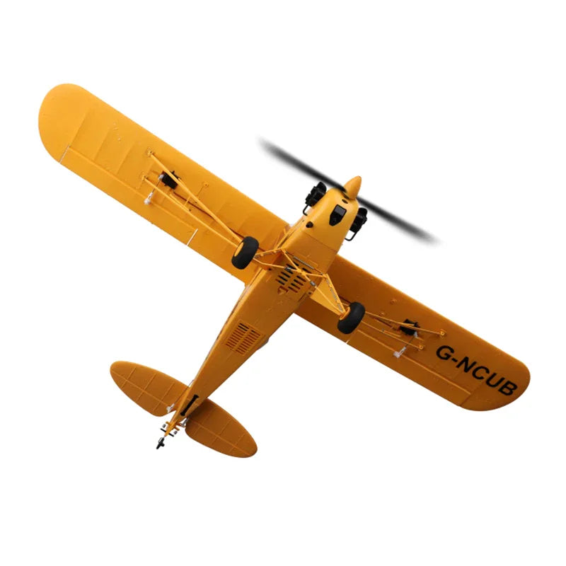 Bottom view of a yellow radio-controlled airplane