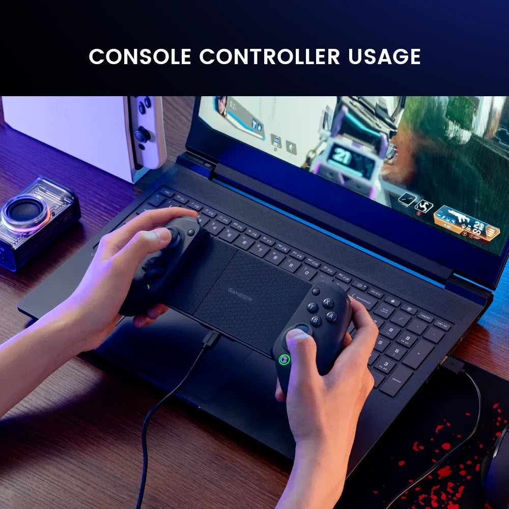 Wireless mobile game controller held in hands while connected to a laptop