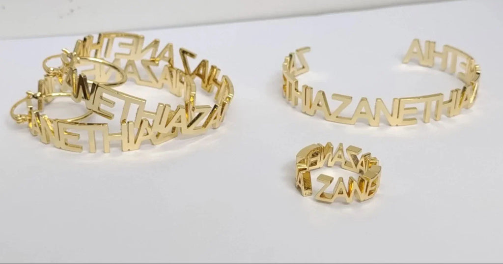A pair of gold-plated stainless steel custom name hoop earrings