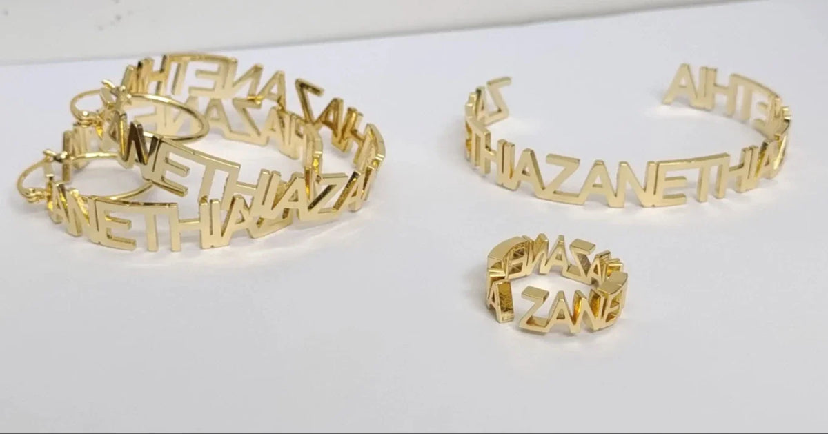 A pair of gold-plated stainless steel custom name hoop earrings