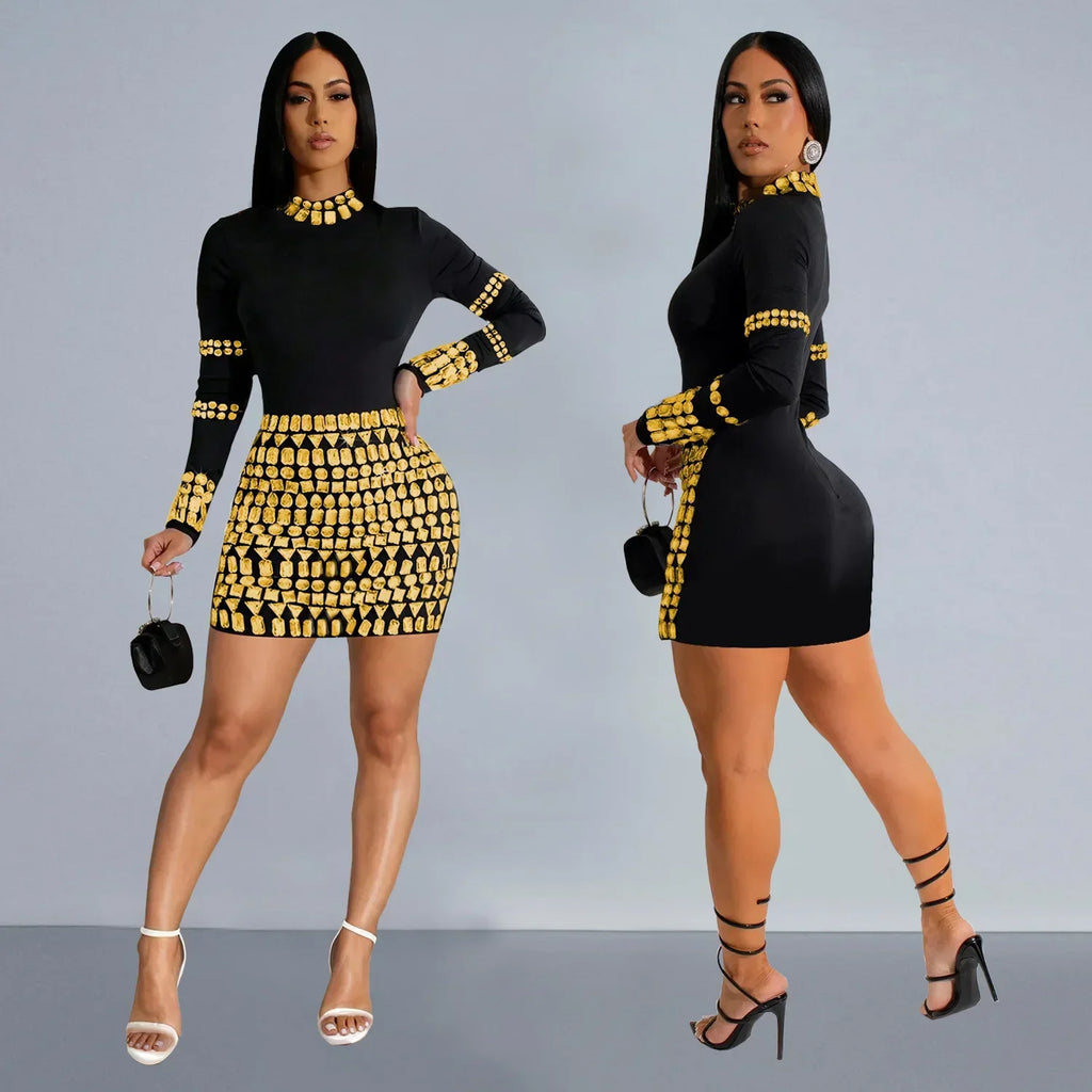Model wearing a black mini dress with gold rhinestone embellishments in front and side views.