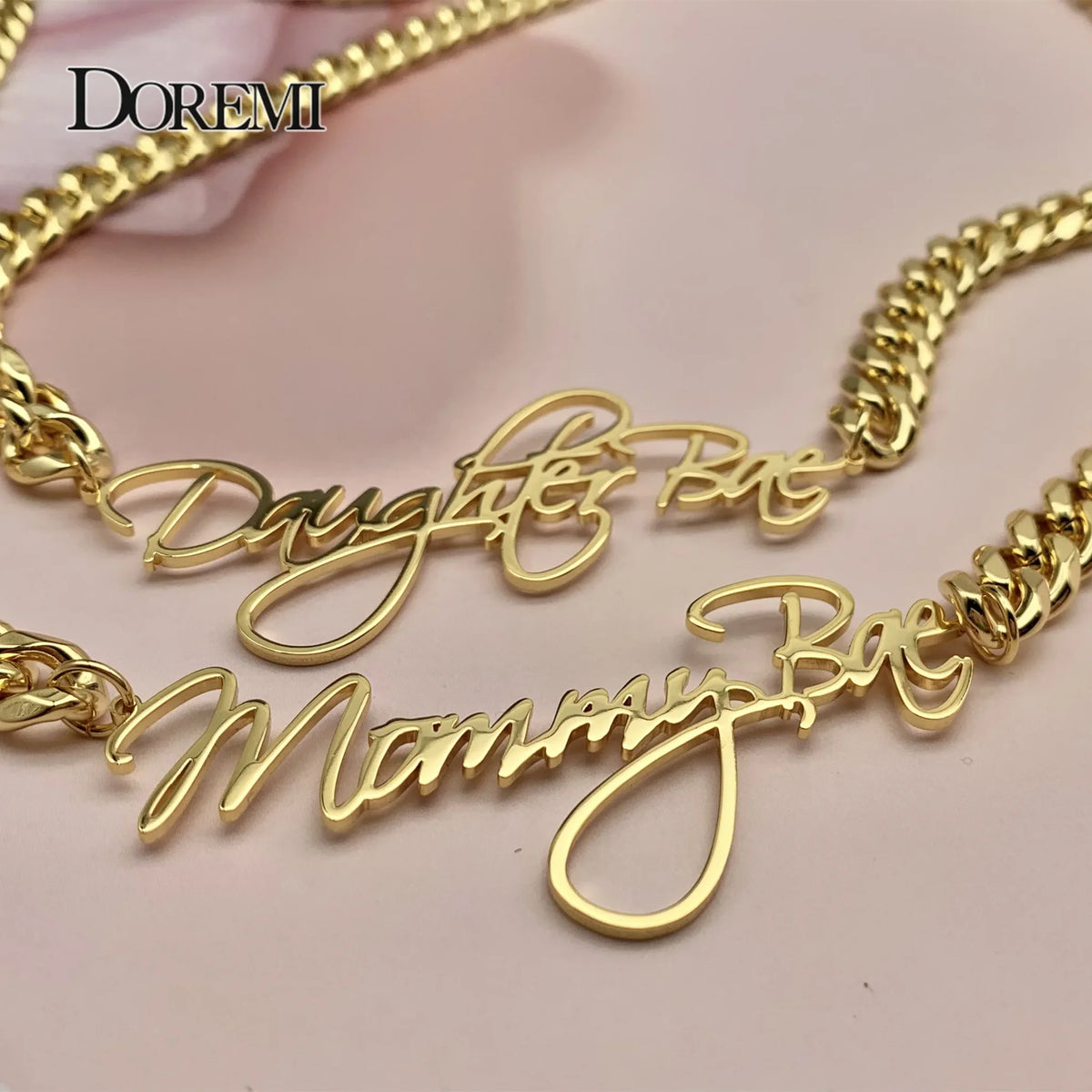 Gold custom nameplate necklaces with thick cuban chains
