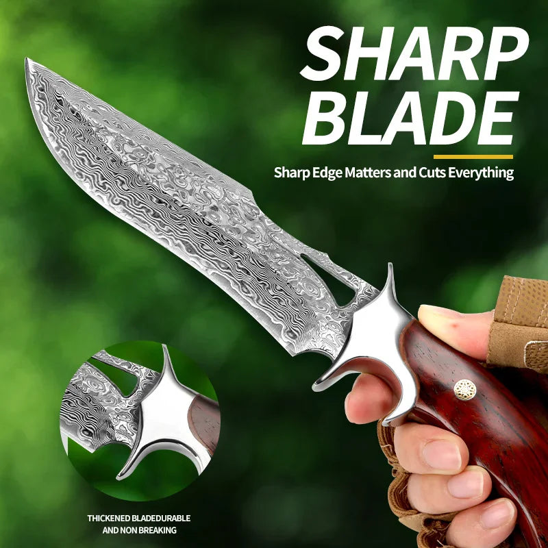 Damascus steel fixed blade knife held in hand