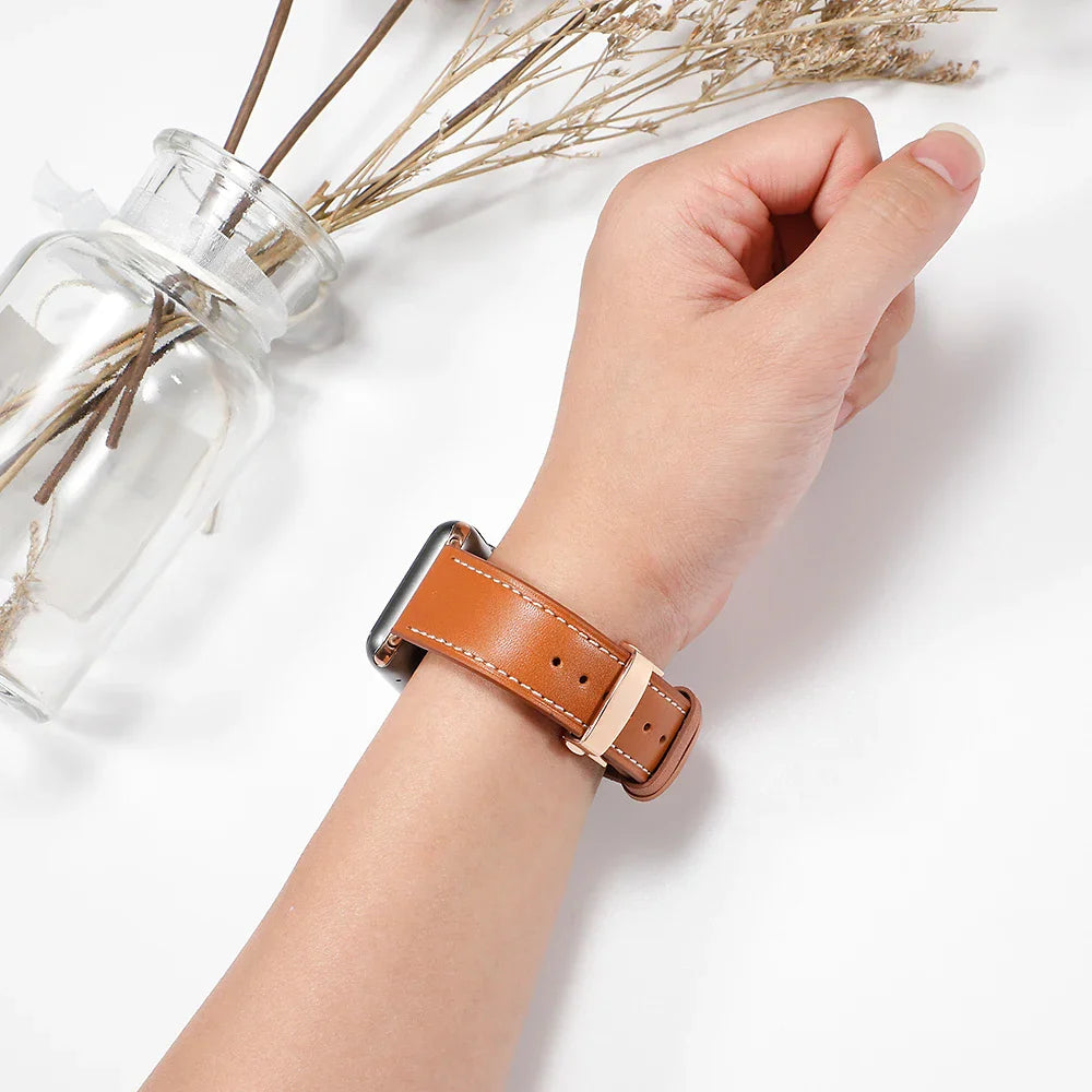 A fabric watch band for Apple Watch available in various colors with silver, black, or rose buttons.