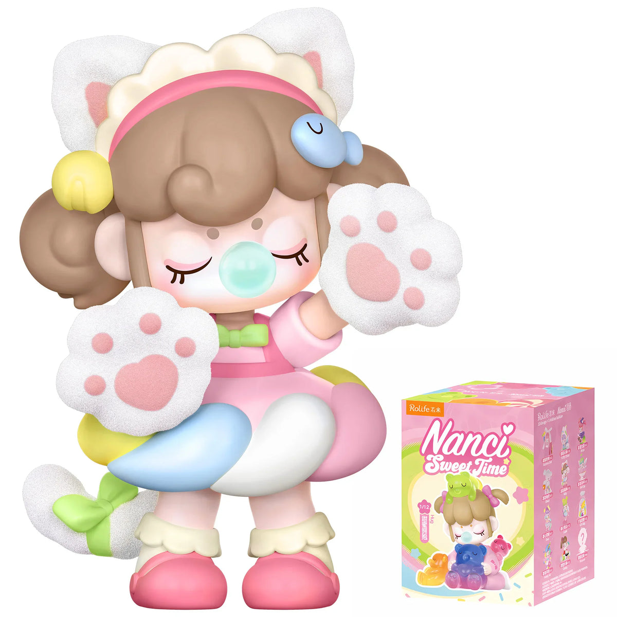 A small girl figurine in a cat costume blowing a bubble, with product packaging box showing other collectible figures.