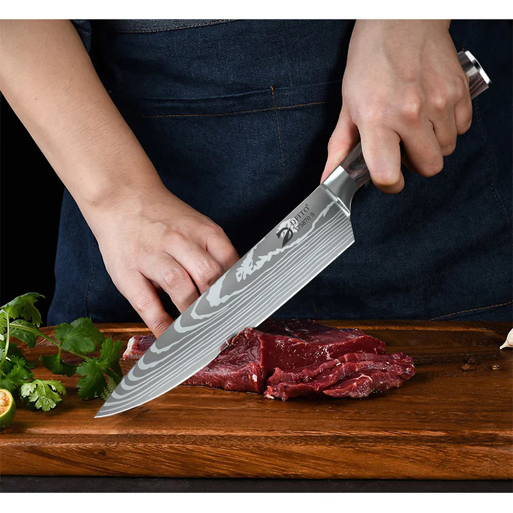 Person slicing a piece of raw red meat on a wooden cutting board with a Damascus steel chef knife.