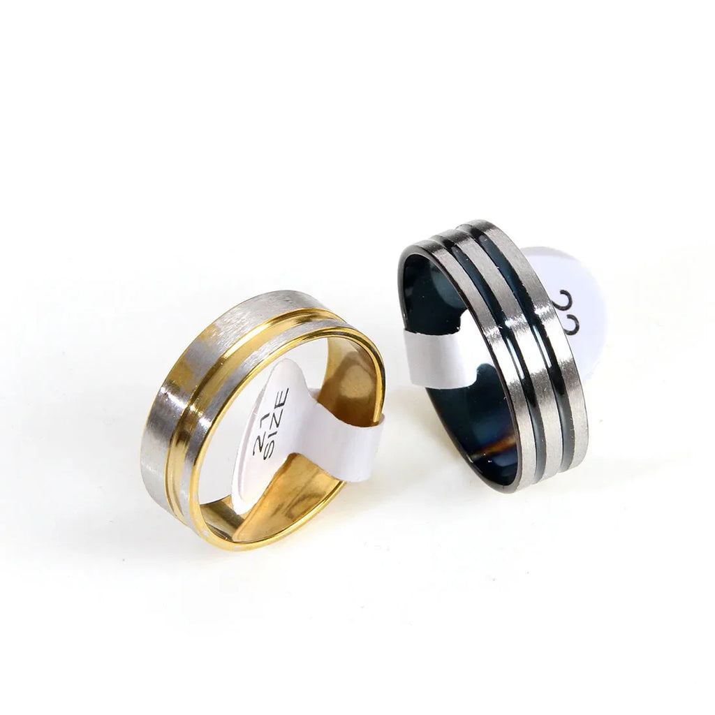 Two two-tone stainless steel bands for men with size stickers attached.