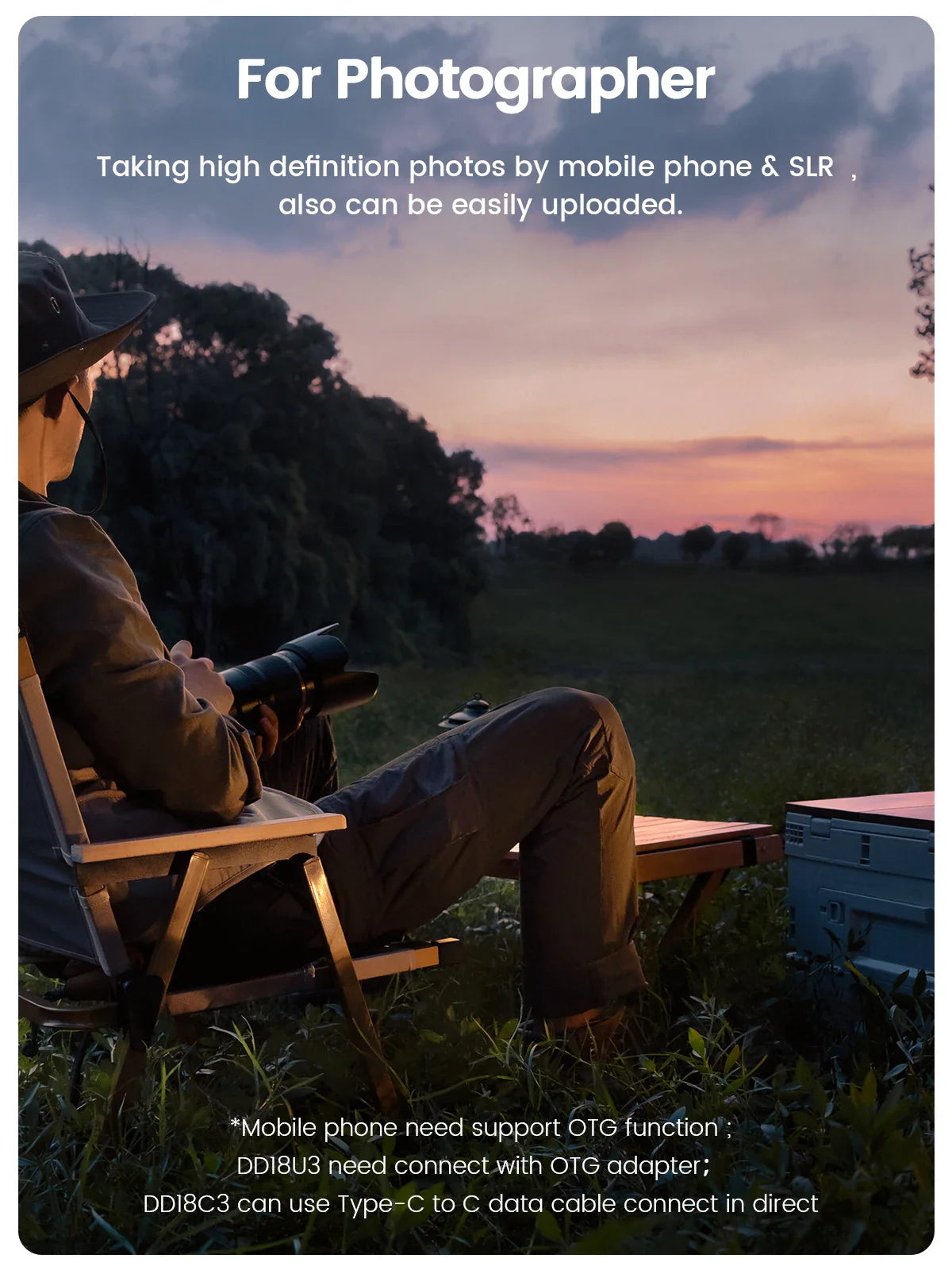Photographer sitting in a chair at sunset outdoors with editing equipment