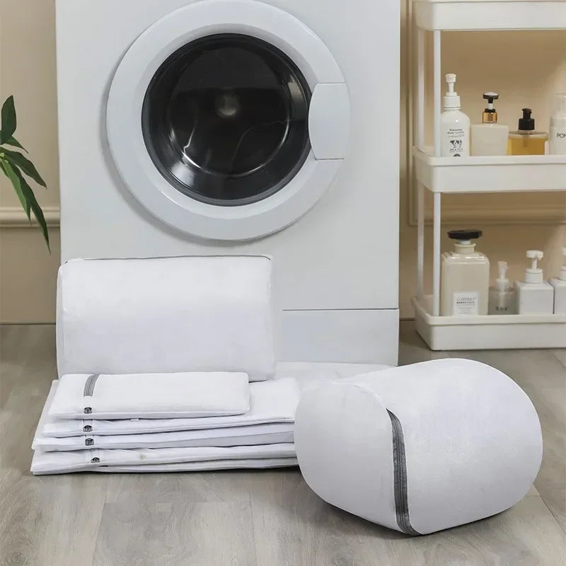 Cylindrical and flat mesh laundry bags for washing machines.