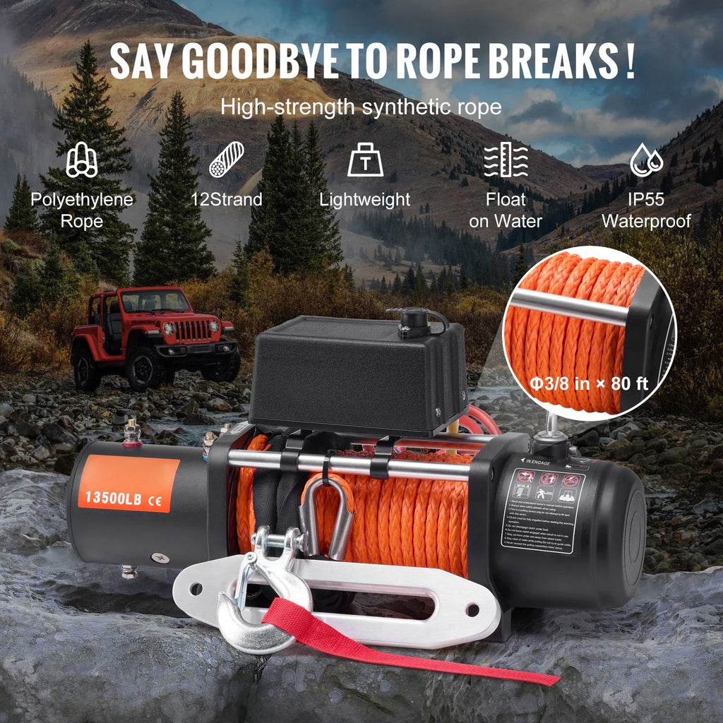 Electric winch with orange synthetic rope and hook set against a mountain background