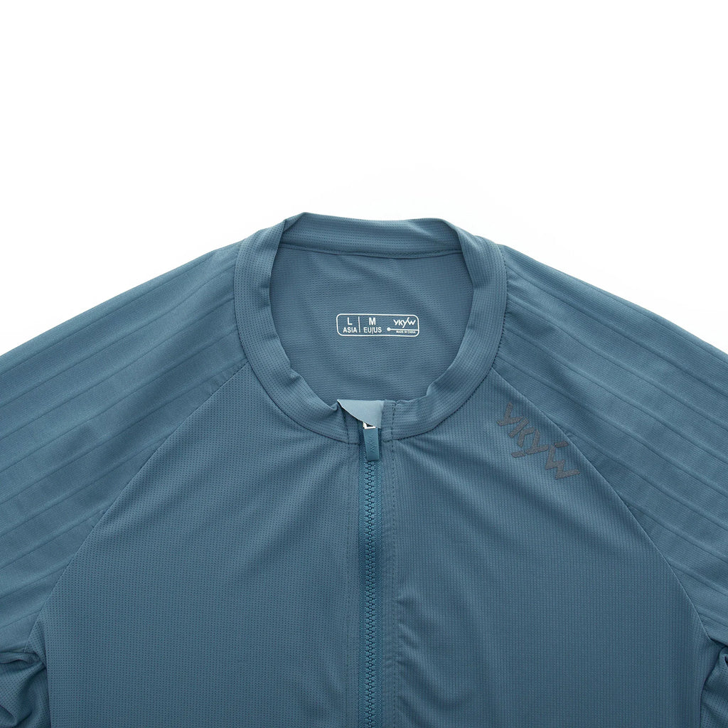 Close-up of the collar and shoulder area of a blue cycling jersey