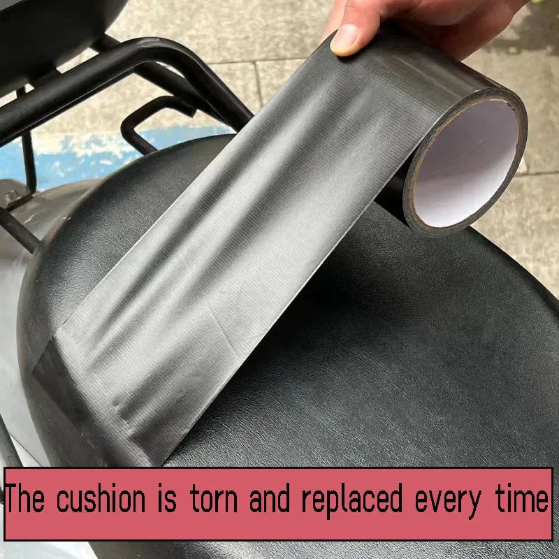 Self-adhesive black leather patch being applied to a motorcycle seat