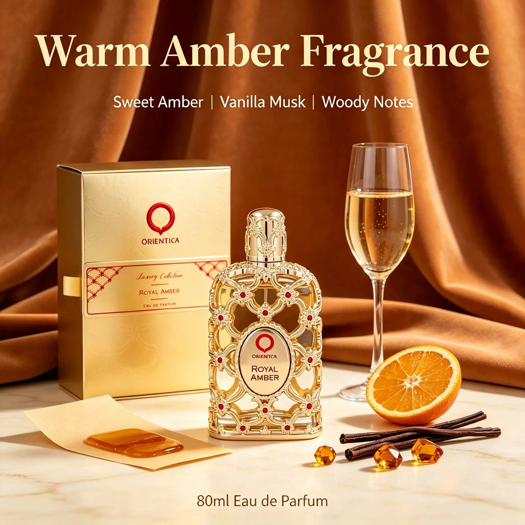 A glass perfume bottle with gold filigree and red stones, next to its gold box, an orange slice, and vanilla pods.