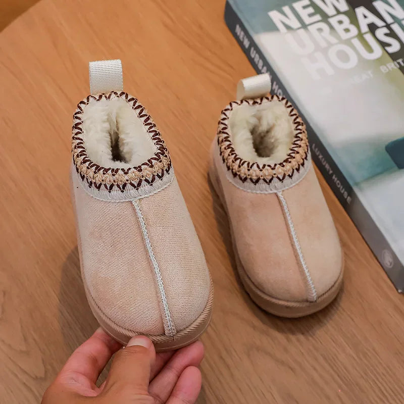 Pair of beige children's ankle boots with brown patterned embroidered collar and fur lining