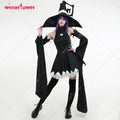 A woman wearing a full black witch cosplay costume with a pointed hat and long oversleeves