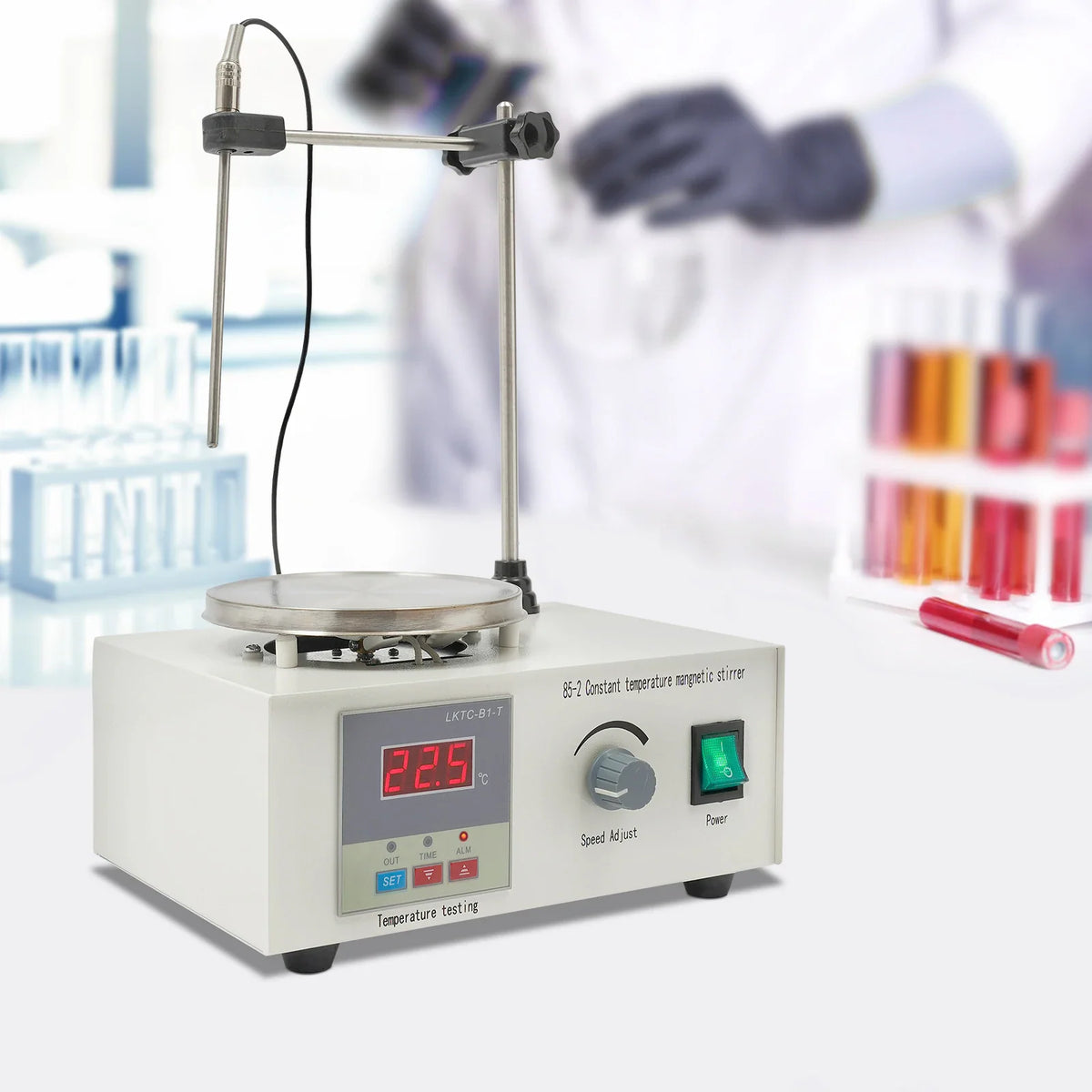 Magnetic stirrer with heating plate, digital temperature display, and temperature probe in a laboratory setting
