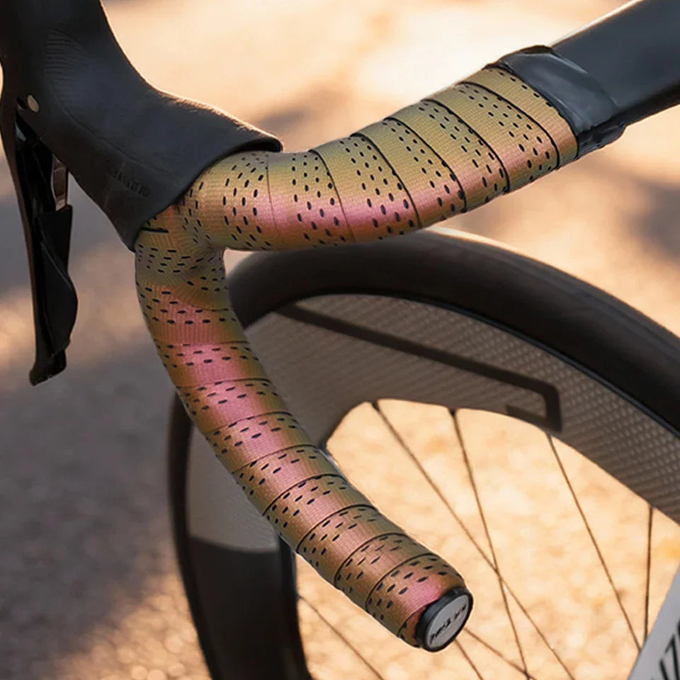 Iridescent bicycle handlebar tape wrapped around drop bars.