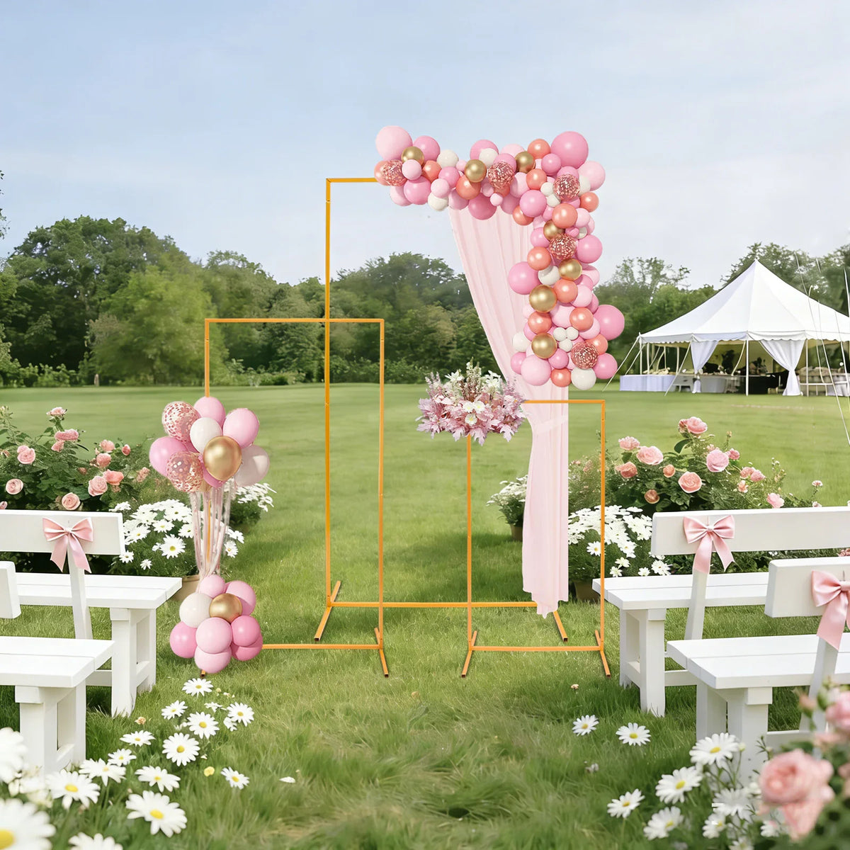 Gold metal display stands decorated with flowers and balloons for a wedding ceremony