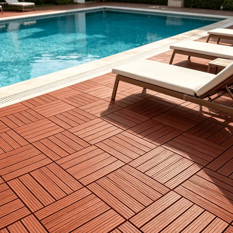 Poolside patio flooring with red interlocking plastic tiles and lounge chairs