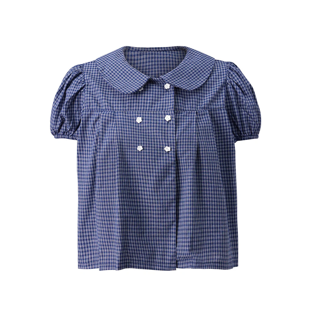 Full view of blue plaid short-sleeve button-down shirt with flower buttons