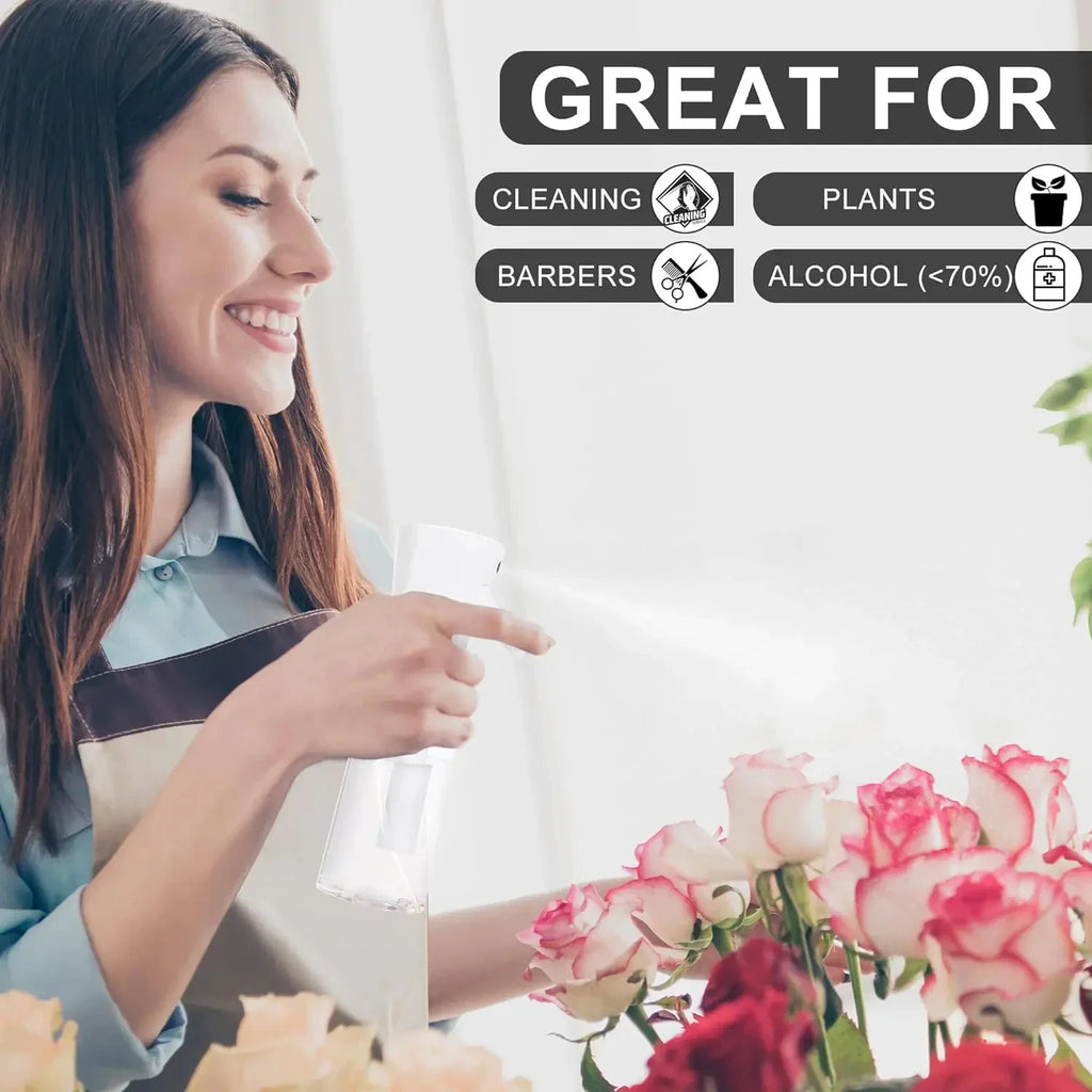 A woman using a white continuous mist spray bottle to water a bouquet of roses