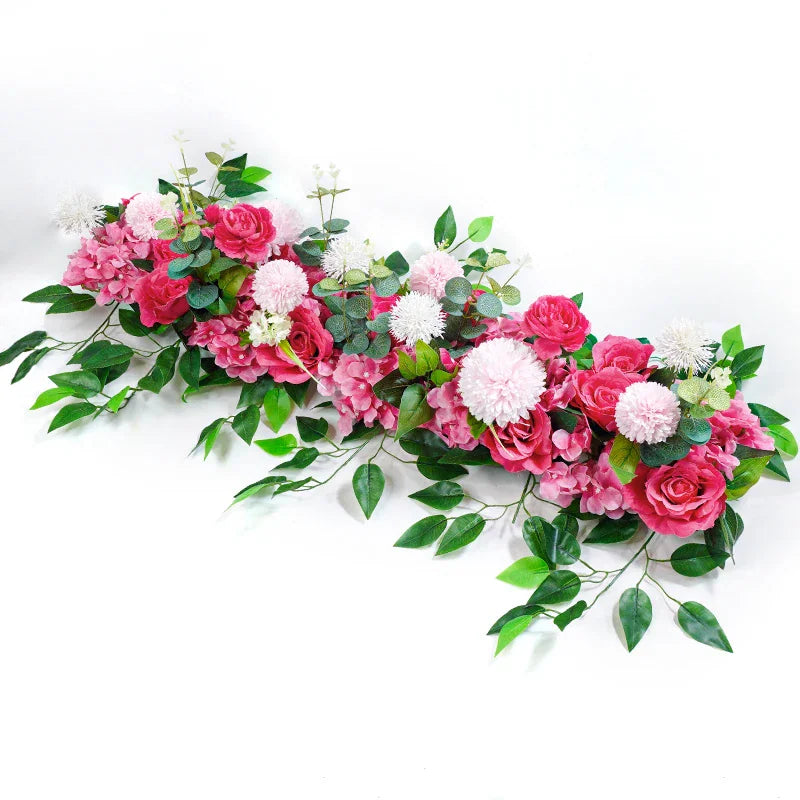 Pink artificial rose and greenery floral centerpiece row for wedding decoration