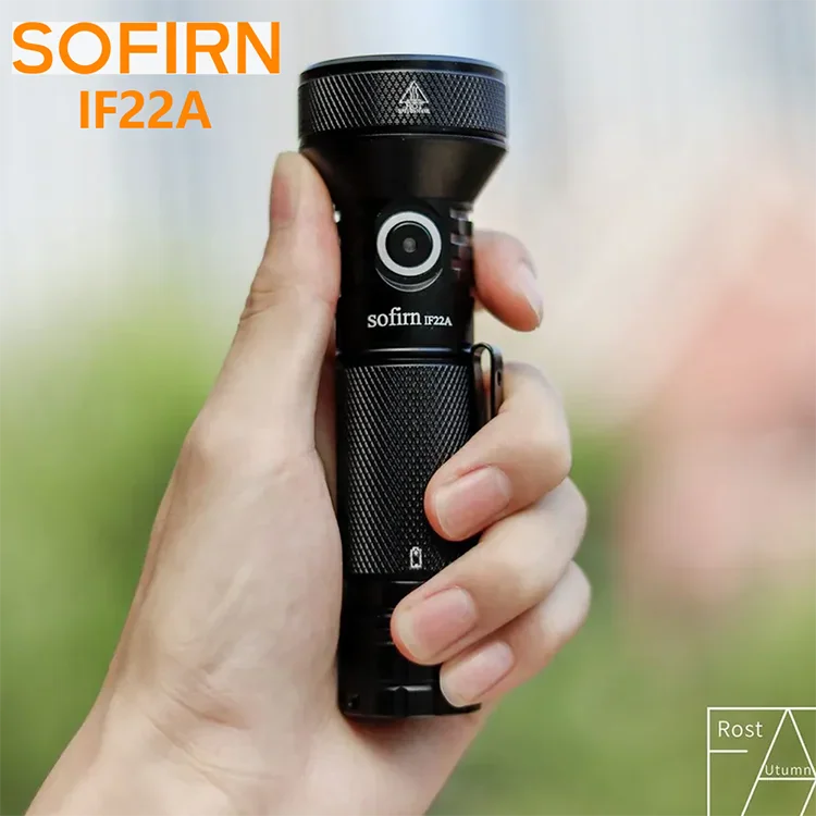 A black LED flashlight held in a person's hand