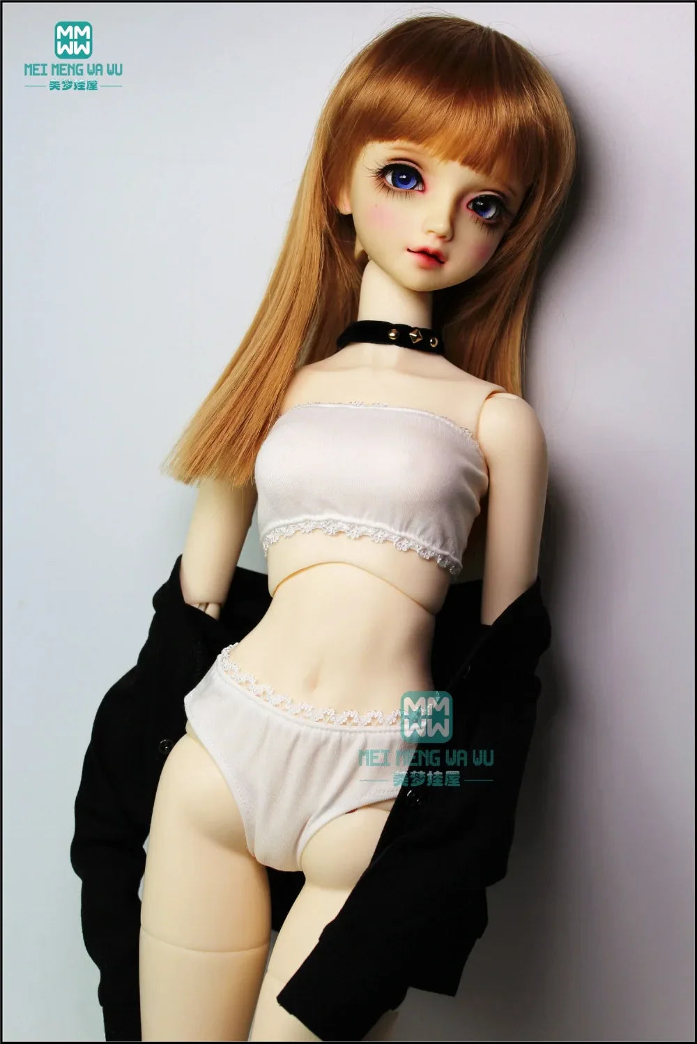 A BJD doll wearing a white tube top and white briefs with a black cardigan