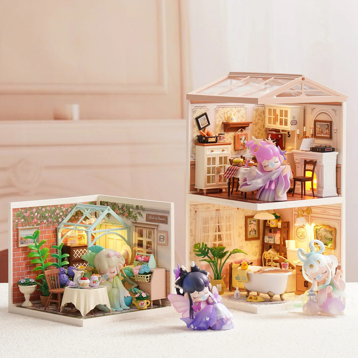 Nanci collectible toy figures displayed within miniature house dioramas with built-in LED lighting.