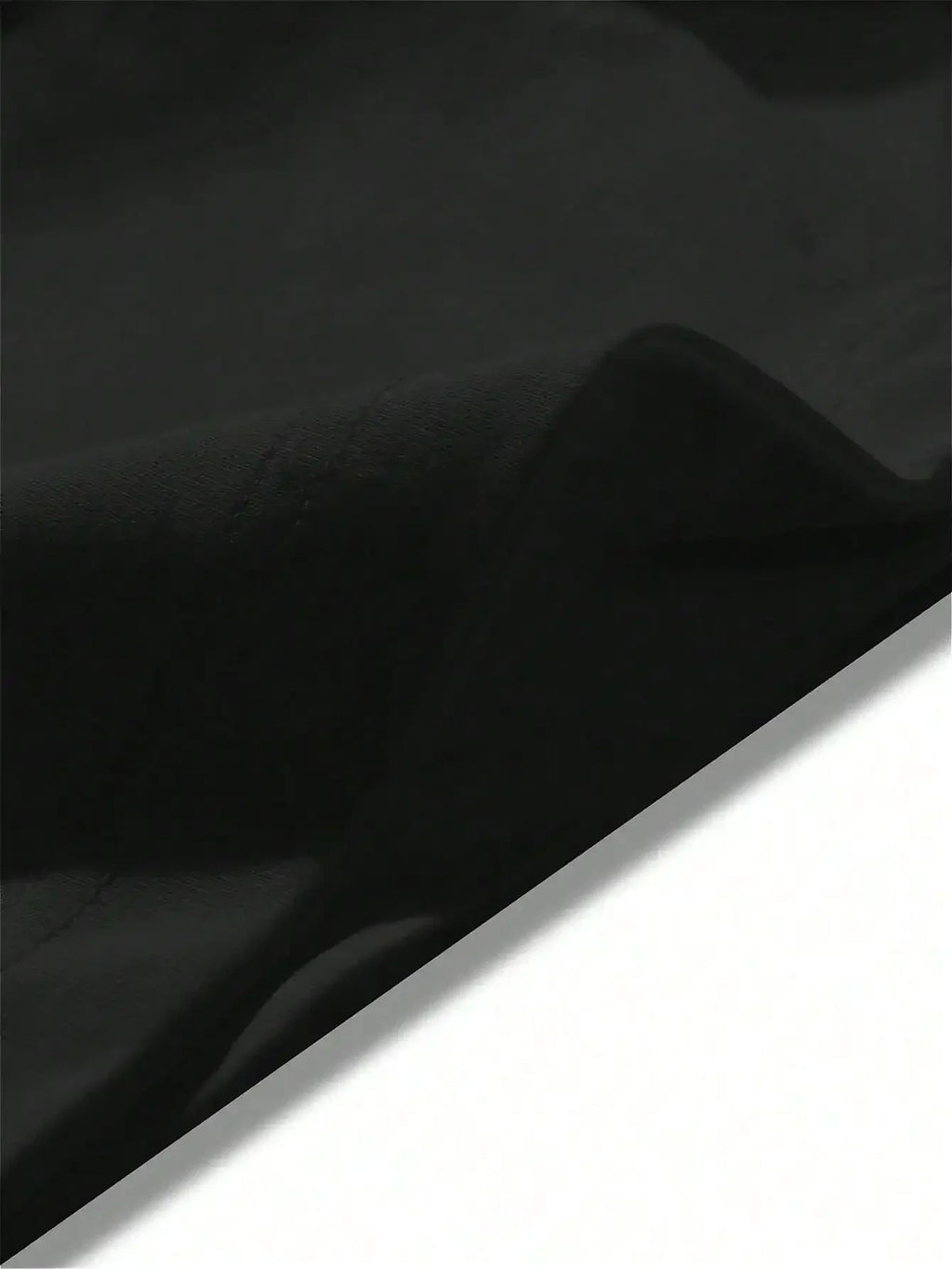 Close-up view of a black t-shirt fabric texture.