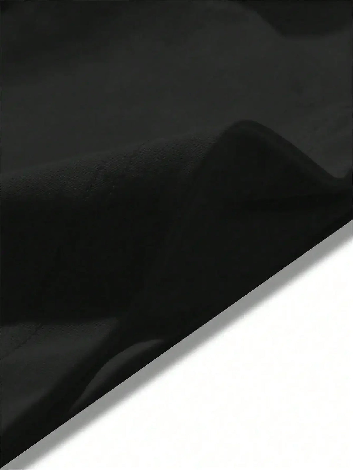 Close-up view of a black t-shirt fabric texture.