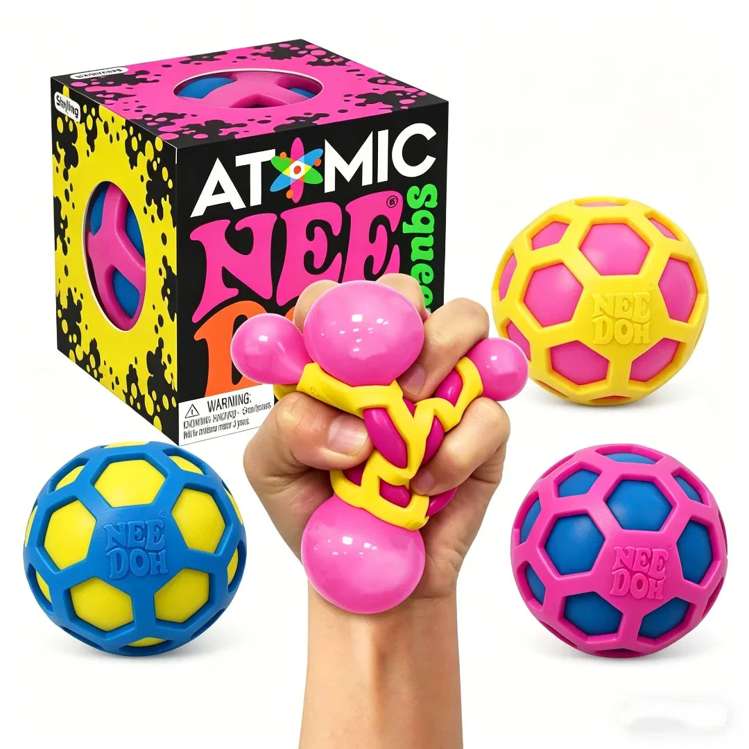 A hand squeezing a colorful stress ball toy with a product box and three spherical fidget toys in the background